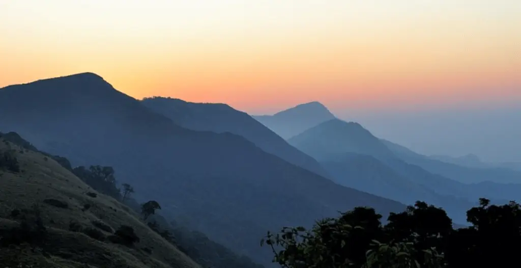 An image showing sunrise in Tadiandamol Treak coorg